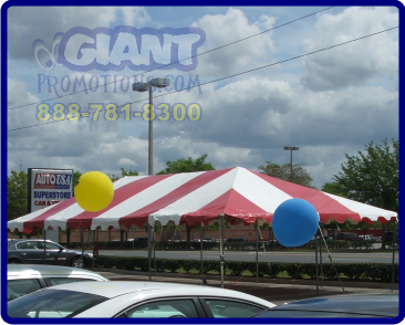 Red and white automotive sales event tent.