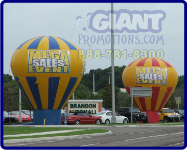 Two cold air giant inflatable advertising balloons.